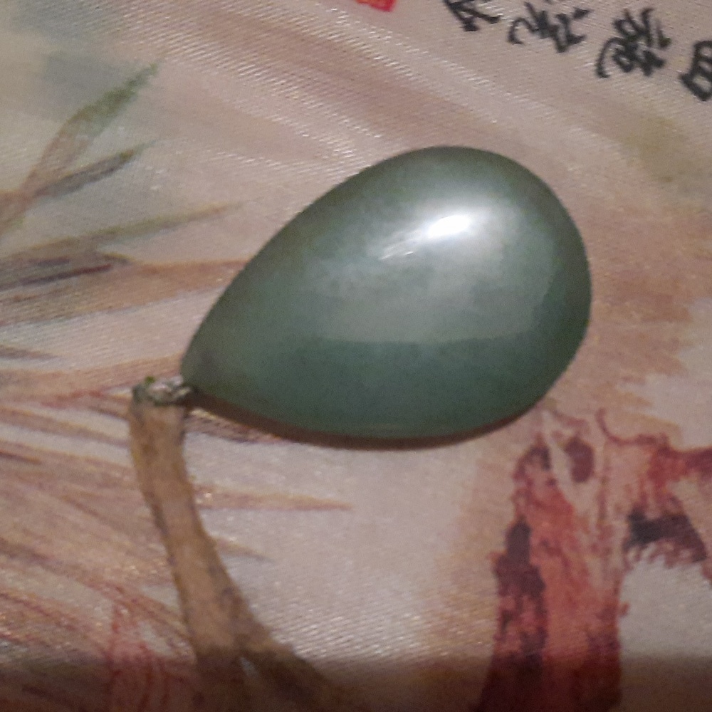 Green aventurine pendant on leather necklace